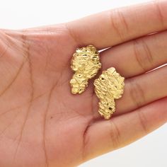 "LoveBling 10K Yellow Gold Nugget Earrings (1.03\" x 0.61\") Stamped and Crafted in Real 10k Yellow Gold Excellent Finish/Durable Diamond Cut Look Fly with this Nugget Earrings in 10k Yellow Gold. The Height from bail to bottom is 1.03\" and the width is 0.61\". This Shiny Sparkling Nugget Earrings Has a 10k Stamp. Perfect for Everyday wear. Great Addition to your Jewelry Collection or a Great Gift for Him or for Her. CHAIN NOT INCLUDED." Gold Nugget Jewelry For Jewelry Making, Gold Nugget Earrings As Gift, Nugget Earrings, 14k Gold Nugget Jewelry Gift, Golden Nugget Earrings, Gold Nugget Jewelry, Natural Gold Nugget, Clean Gold Jewelry, Gold Nugget