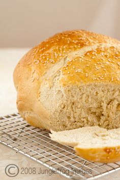 a loaf of bread sitting on top of a cooling rack