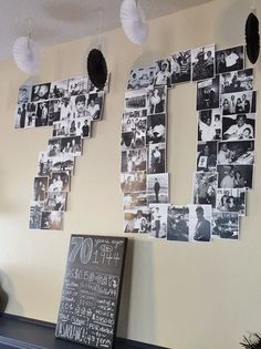 the wall is decorated with photos and hanging on it's sides, along with a chalkboard sign