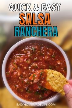 quick and easy salsa ranchera recipe in a white bowl with a hand holding a tortilla chip