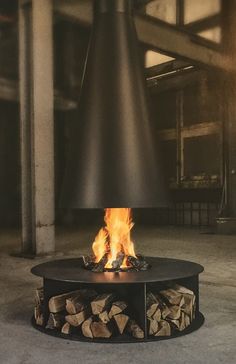 a fire pit with logs in the middle