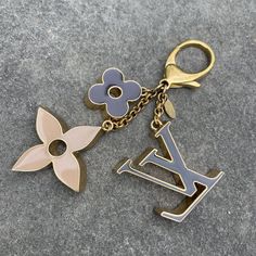 This Louis Vuitton Key Chain Is A Must-Have Accessory For Women Who Love Designer Fashion. The Keyring Is Made Of High-Quality Metal And Comes In A Beautiful Gold Color With The Iconic Lv Logo And Designer Charm. It Is Perfect For Carrying Your Keys In Style And Making A Fashion Statement. Things To Note: * Light Scratches Throughout * 100% Authentic *Box And Dust Bag Not Included Louis Vuitton Keychain, Lv Logo, Bag Charms, Louis Vuitton Accessories, Key Card Holder, Authentic Louis Vuitton, Gold Black, Key Chain, Fashion Statement