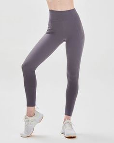 Featuring zip up pockets and stylized seam lines to create an elevated yet stylish performance legging. Our signature Silkiflex™ fabric is 4 way stretch and the ideal support for any workout, from yoga to high intensity cardio. The luxuriously shiny finish wicks away sweat and keeps you cool during your most intense moments. Machine Wash Inseam 27" Model is 5'7" wearing size S Tight Gray Elastane Activewear, Gray Tight Elastane Activewear, Gray 4-way Stretch Elastane Activewear, Gray Elastane Activewear With 4-way Stretch, Gray Elastane 4-way Stretch Activewear, 4-way Stretch Activewear With Side Pockets For Pilates, Four-way Stretch Activewear With Side Pockets For Pilates, Versatile High Stretch Activewear With Side Pockets, Gray Activewear For Gym With Side Pockets