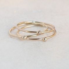 ONE dainty (1mm) solid 14k gold stacking band is adorned with a teensy 14k gold droplet.  Small and dainty, stack several as a set or wear with some of the other stacking rings in our collection for variety.  We think you could love these, too:►Sterling SILVER tiny droplet ring: http://etsy.me/1x03Qe2►Gold GEMSTONE stacking ring:  http://etsy.me/1zpjYI0►Gold INITIAL ring:  http://etsy.me/1gamTHo** Enjoy browsing our shop: http://etsy.me/1mC0gmu **{YOU CAN SAVE!} Think bridesmaids, gifts, keep on Dainty 14k Gold Stackable Rings, Minimalist 14k Gold Stackable Midi Rings, Minimalist Recycled Gold Stackable Toe Rings, Simple Tiny Yellow Gold Stackable Rings, Dainty 14k Gold Stackable Toe Rings, Minimalist Stackable Midi Rings In Recycled Gold, Minimalist Stackable Recycled Gold Midi Rings, Simple 14k Gold-filled Yellow Stackable Rings, Simple 14k Gold Filled Yellow Stackable Rings