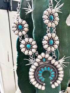 Make waves with the Selene Necklace! This statement concho necklace, adorned with beautiful turquoise stones, is sure to bring you all the compliments! With a unique style that stands out in the crowd, you'll be wearing this gorgeous piece around your neck all season long! 💎 *** EARRINGS ARE NOT INCLUDED.*** Bohemian Necklaces For Western-themed Events, Turquoise Necklace For Western-themed Events, Blue Bohemian Concho Necklace, Bohemian Blue Concho Necklace, Turquoise Concho Bohemian Necklace, Turquoise Bohemian Concho Necklace, Bohemian Concho Jewelry For Western-themed Events, White Turquoise Bohemian Necklace, Concho Necklace