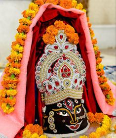 an idol is decorated with flowers and garlands