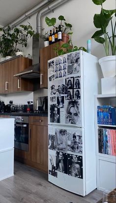 a white refrigerator freezer sitting inside of a kitchen next to a stove top oven