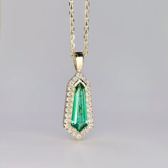 "This is a kite shaped emerald pendant necklace 14K solid gold. The unique long emerald necklace is the May Birthstone gemstone. This dainty layering necklace makes a great Holiday, Christmas, mothers day, birthday or bridal party gift. To revisit our shop click here: https://etsy.me/3Pzzwpx For more emerald necklace options click here: https://etsy.me/3Td2gnv For emerald earrings click here: https://etsy.me/3AN4nqW The pendant pictured is a lab created emerald #8283 Available with lab created r Emerald Pendant Necklace, Dainty Necklace Layered, Emerald Necklace Pendant, Emerald Blue, Jewelry Dainty, Emerald Pendant, May Birthstone, Personalized Pendant, Emerald Necklace