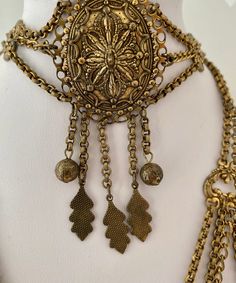 "Etruscan Revival Festoon Necklace and Bracelet Set Gold Tone Ornate Vintage Patina Necklace - 16.5\" plus festoon drop with dangles additional 4\" Length Bracelet - 7.5\" Bracelet medallion 1.76x x 1.50@ No markings Aged patina, can use white vinegar to brighten if preferred" Vintage Festival Jewelry With Adjustable Chain, Bohemian Bronze Jewelry For Wedding, Antique Adjustable Necklace For Festivals, Antique Adjustable Necklaces For Festivals, Ornate Adjustable Antique Gold Jewelry, Bronze Ornate Jewelry With Historical Design, Adjustable Antique Necklaces For Festivals, Elegant Antique Finish Jewelry For Festivals, Antique Brass Jewelry For Festivals