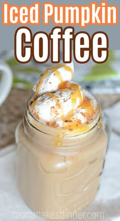 iced pumpkin coffee in a mason jar with whipped cream on top