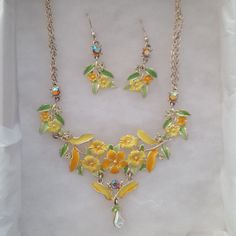 Perfect For Spring And Summer! This Yellow And Silver Necklace, With A Few Rhinestones, Brings A Smile To Who Wears It As Well As Those Who Get To See It On! Never Worn. The Earrings Add The Finishing Touch! Approximately 9-10" Long Depending On The Placement Of Clasp Approximately 4" Wide Fancy Necklace, Yellow Floral, A Smile, See It, 9 And 10, Necklace Set, Womens Jewelry Necklace, Silver Necklace, Jewelry Necklaces