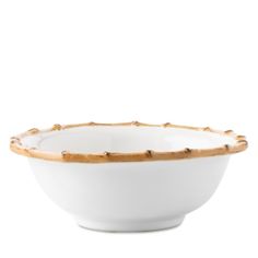 a white bowl with gold trimmings on the rim and bottom, sitting in front of a white background