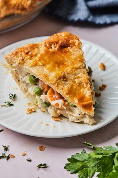 a slice of chicken pot pie on a white plate