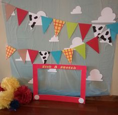 a photo frame sitting on top of a wooden table next to a stuffed animal bear