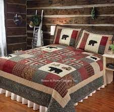 a bed room with a neatly made bedspread and pillows