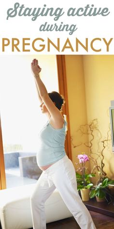 a pregnant woman doing yoga in front of a window with the words staying active during pregancy