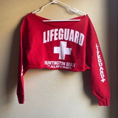 Red Lifeguard Huntington Beach California Sweatshirt In Perfect Condition. Washed One Time But Never Worn. Tag Says Size Large But Was Purchased For 12-Year-Old Girl. Not Full Length Sweatshirt. Probably Half Top Or Almost Full Length Smoke And Pet Free Environment. Half Top, California Sweatshirt, Huntington Beach California, Beach California, Huntington Beach, One Time, Red White, Scoop Neck, Full Length