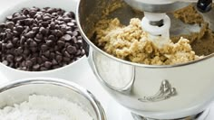 a mixer with chocolate chips and flour in it next to other bowls filled with batter