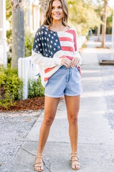 This sweater is honestly the best all around! It's so cute and we love the loose knit fabric! This sweater is going to look so good with denim shorts this summer for those patriotic holidays! It will even look super cute over a swimmy by the lake! This sweater features a wide neckline, long sleeves, a loose knit, and an American flag print. 
Material has a generous amount of stretch.Cam is wearing the small. Flag Sweater, American Flag Sweater, American Flag Print, Cruise Outfits, Cute Spring Outfits, Patriotic Holidays, By The Lake, Stylish Clothes, Loose Knit