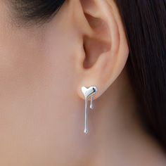 These elegant, unique, mix match asymmetric stud earrings features a shape of heart with dripping droplets, made from solid 925 sterling silver, highly polished for a great shine, come in silver or gold color. Add a playful touch to your outfit with these stunning earrings. Their unique mix of heart and dripping droplets make them stand out from the crowd. Made from high-quality 925 sterling silver, these earrings are durable and shiny, and come in both silver and gold options to match any style Modern Sterling Silver Heart Earrings For Gift, Trendy Sterling Silver Heart Dangle Earrings, Dripping Heart, Shape Of Heart, Sterling Silver Stud Earrings, Silver Stud Earrings, Fine Jewelry Collection, Heart Studs, Stunning Earrings