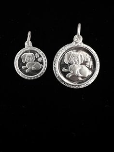 Made of solid fine silver.  The Dog is the 11th of the 12 Chinese zodiacs. They are lovely, honest, prudent. They are born on the years: 1958, 1970, 1982, 1994, 2006, 2018, 2030 On the back of the small pendant is the character Fu, representing good blessings and good luck. Measures at 15mm diameter. On the back of the larger pendant are the characters Xingfu, representing blessing of a good life of happiness and satisfaction. Measures at 20mm diameter. Rat Zodiac, Dog Zodiac, Rabbit Pendant, Heart Pendant Gold, Zodiac Pendant, Small Pendant, Pendant Silver, Good Life, Silver Stars