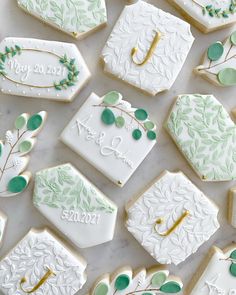 decorated cookies are arranged on a table