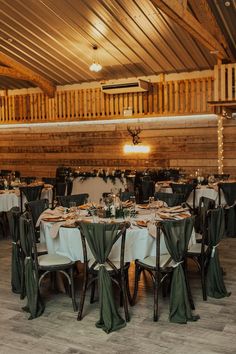 olive green wedding decor and chair drapes in a barn wedding Green Wedding Theme Outdoor, Olive Green And Beige Wedding Theme, Brown White Green Wedding, Wedding Theme Dark Green, Olive Colored Wedding, Wedding Color Schemes Olive Green, Olive Green Country Wedding, Forest Green And Wood Wedding, Green Brown And Cream Wedding