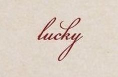 the word lucky written in cursive ink