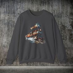 The Vintage Railway Steam Engine Locomotive Train Sweatshirt, Mens T-Shirt is ideal for the train enthusiast, someone who enjoys actual trains, plays with model trains and pretends to be the conductor, or someone who works for a railway firm and is familiar with locomotives and steam engines. Men's Vintage Locomotive Train Engine, Watercolor Train Engine, Hand Painted Train, Gift for Dad or Friend, Ideal for Vintage Train Lovers 👉🎨About the Designer: At FlooredByArt Studios, I blend a passion for nature and animals with over 30 years of artistic expertise. Each design, crafted with cutting-edge digital tools, aims to capture the essence of wildlife, pets, and horses. My work is both whimsical and detailed, creating unique, vibrant art that reflects current trends. Your suggestions and cu Locomotive Train, Unique Watercolor, Steam Engines, Vintage Train, Current Trends, Digital Tools, Sweatshirt For Men, Instagram Outfits, Steam Engine