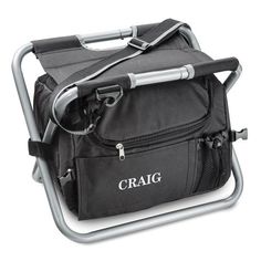 the craig rolling cooler is black with silver trim and handles on it's side