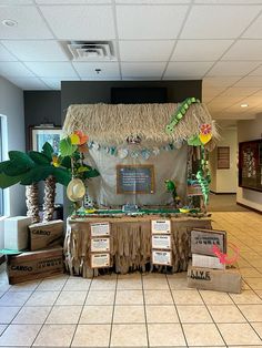 a table that has some boxes on it and a tiki hut in the background