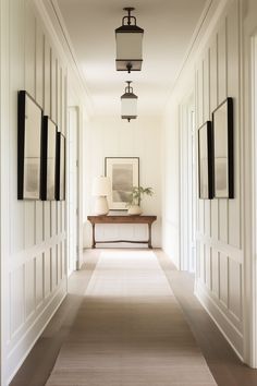 the hallway is clean and ready for guests to use it as an entrance way in this home