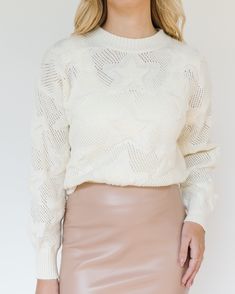 This skirt is an elegant, high-waisted, pencil-style midi skirt that extends down to the mid-calf, offering a refined and sophisticated look. It is crafted from a faux leather material, which gives it a sleek and polished appearance, with a subtle shine that catches the light. The skirt comes in a soft beige or nude color, making it a versatile piece that can be paired with a variety of tops and accessories. The material appears structured yet flexible, providing both comfort and a body-hugging fit that accentuates the wearer's silhouette. The back of the skirt features a center slit, strategically placed for functionality and ease of movement, while maintaining the classic pencil skirt shape. This design choice adds an element of practicality without compromising the streamlined aesthetic Faux Leather Midi Skirt, Color Making, Leather Midi Skirt, Soft Beige, Star Pattern, Nude Color, Star Patterns, Leather Material, Mid Calf