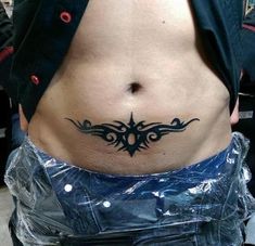 a man with a tattoo on his stomach