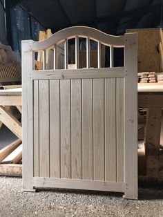 a wooden gate sitting in the middle of a room