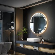 a bathroom with a sink, mirror and bathtub in the middle of the room