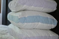 three pillows stacked on top of each other