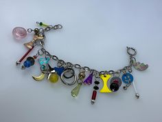 Vintage 7.5" Bracelet Silver Toned Chain With Assorted Multicolor Beads Used Multicolor Party Charm Bracelet With Colorful Beads, Party Multicolor Charm Bracelet With Colorful Beads, Bohemian Multicolor Metal Charm Bracelet, Bohemian Style Multicolor Metal Charm Bracelet, Multicolor Beaded Metal Charm Bracelet, Multicolor Metal Bracelets With Round Beads, Party Multicolor Charm Bracelet With Round Beads, Multicolor Charm Bracelet With Round Beads, Handmade Multicolor Dangle Charm Bracelet