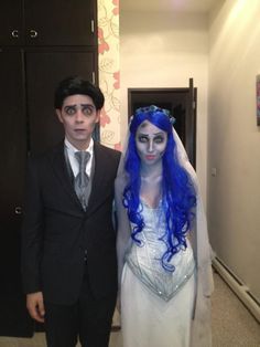 a man and woman dressed up as corpse from corpse brides in a hallway next to each other