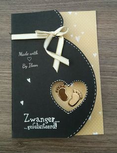 a handmade card with a baby's foot in the shape of a heart