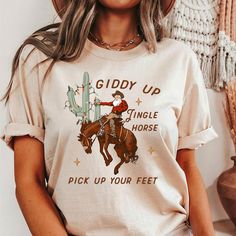 Giddy Up Jingle Horse  Shirt, Western Graphic Tee, Cowboy Christmas Shirt, Western Santa Shirt, Cowgirl Graphic T-Shirt Giddy Up, Cowgirl Graphic, Western Graphic Tees, Santa Shirt, Cowboy Christmas, Horse Shirt, Santa Shirts, Western Christmas, Cow Girl