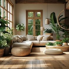 a living room filled with lots of furniture and plants on the floor in front of large windows