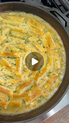 a pan filled with food sitting on top of a stove