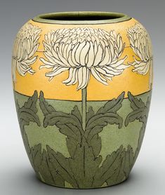 a vase with flowers painted on it