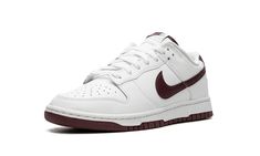 The Nike Dunk Low “White/Night Maroon” is a colorway of the legacy sneaker with clean, two-tone color scheme.  The upper has a predominantly white leather construction with a Night Maroon leather Swoosh logo on both sides.  More Night Maroon accenting can be found on the “Nike” embroidery on the heel and the “Nike” and Swoosh logos on the tongue.  Underfoot, the shoe’s white midsole and maroon outsole put the finishing touch on the design.  Release date: March 25, 2023 Classic White Custom Nike Sneakers, Nike White High-top Sneakers With Gum Sole, Classic White High-top Sneakers With Speckled Midsole, White Nike Classic High-top Sneakers, Classic White Nike High-top Sneakers, Classic White Sneakers For Streetwear, White Custom Sneakers With Vulcanized Sole For Streetwear, Urban White Custom Sneakers With Vulcanized Sole, Nike White Sneakers With Speckled Midsole