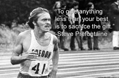 a man running in a race with a quote on the front and bottom half of his shirt