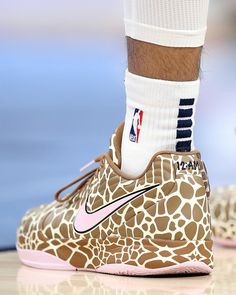 the nike basketball shoe has a giraffe print pattern on it's upper part