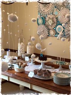 a table topped with lots of food and desserts