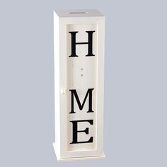 a white wooden block with the word home on it's front and back sides