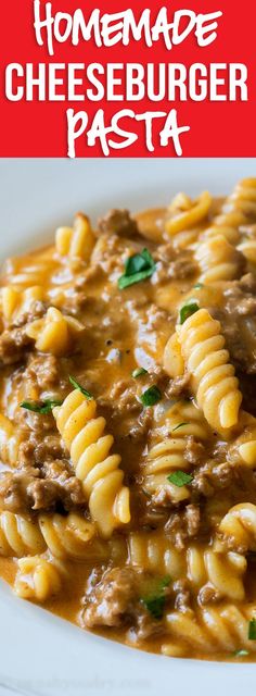 a white plate topped with pasta covered in cheese and meat sauce next to a fork